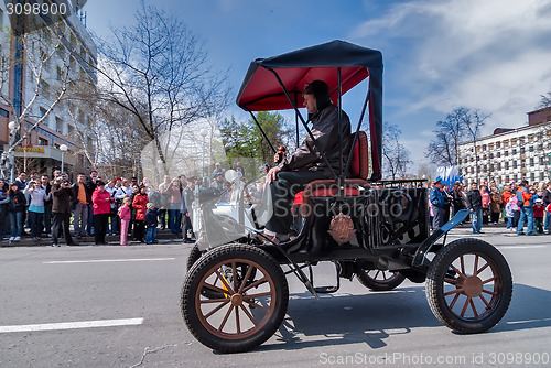 Image of Retro car of 19 century participates in parade