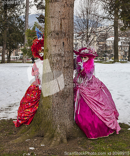 Image of Disguised Couple Playing