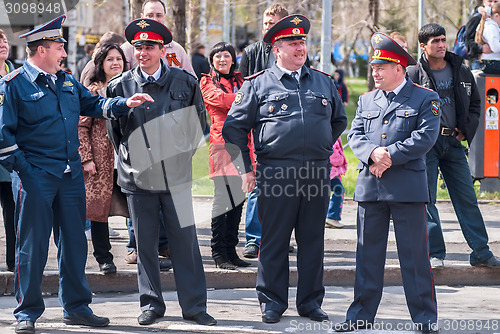 Image of Four policemen stand in cordon