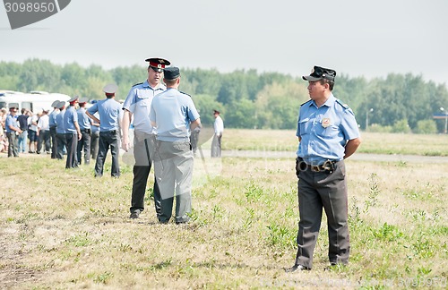 Image of Policemen stand in cordon