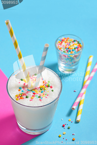 Image of Glass of milk with striped straws