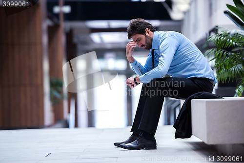 Image of frustrated young business man