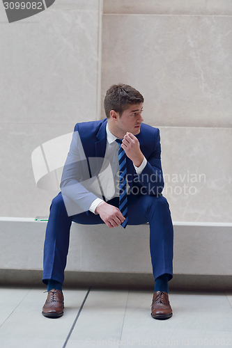 Image of frustrated young business man