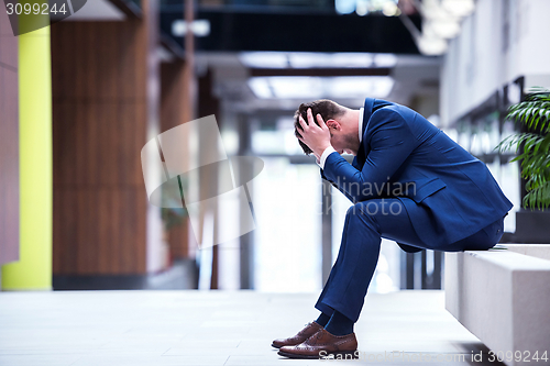 Image of frustrated young business man