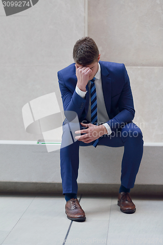 Image of frustrated young business man