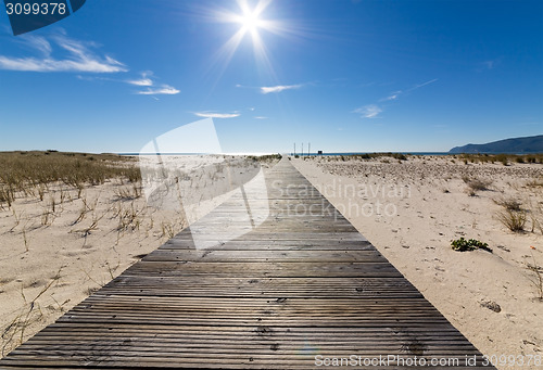 Image of Wooden Walkway Leading to the Beach over Sand Dunes