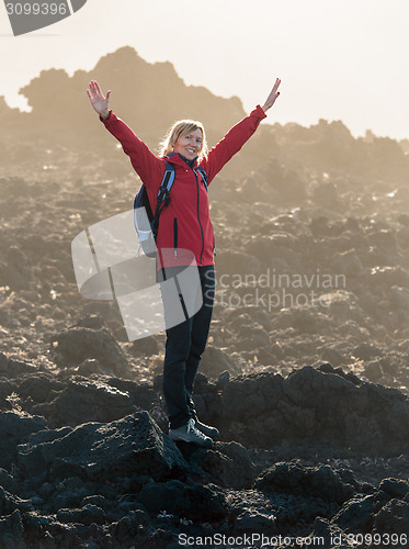 Image of Smiling Woman with Open Hands