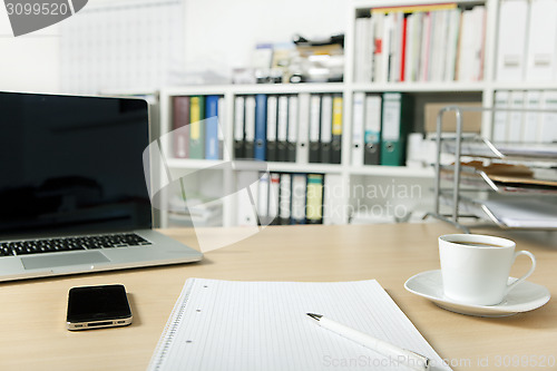 Image of office with laptop and mobile phone