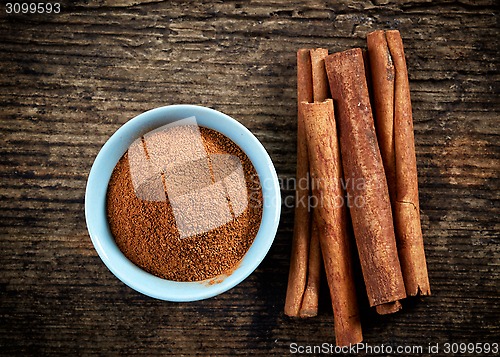 Image of cinnamon powder and sticks