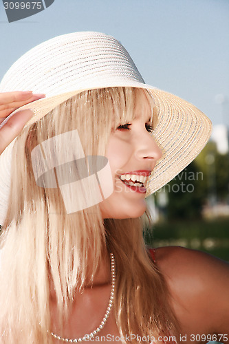 Image of Young woman with hat