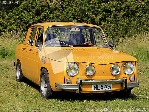 Image of Yellow Renault 8S Car Parked on Grass