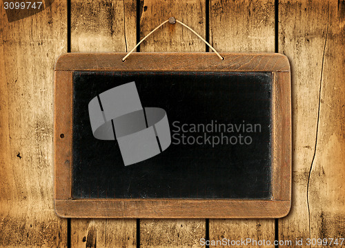 Image of Blackboard on a wood wall background
