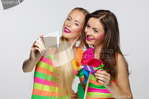 Image of Girls taking selfie with smartphone