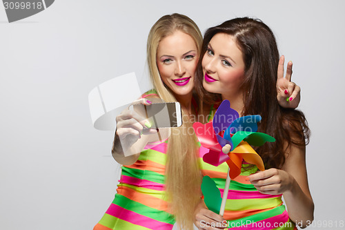 Image of Girls taking selfie with smartphone