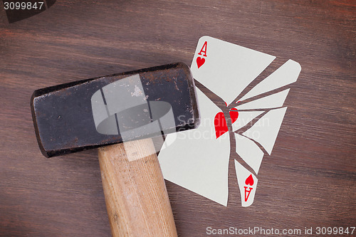Image of Hammer with a broken card, ace of hearts