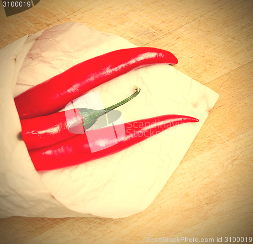 Image of red hot chili peppers in paper bags