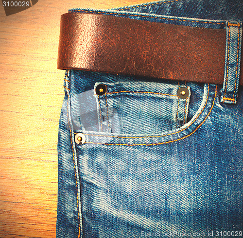 Image of jeans with leather belt