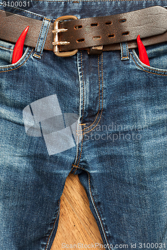 Image of vintage jeans with red chili pepper