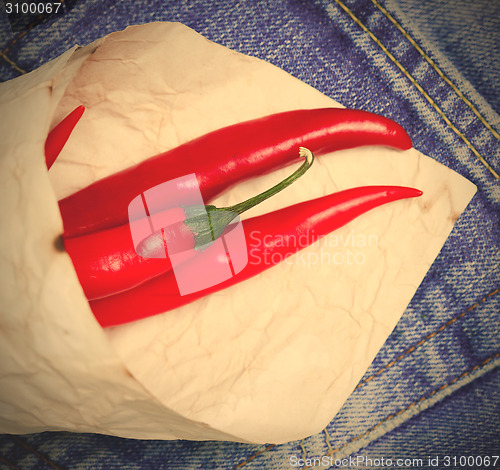 Image of red hot chili peppers in paper bags