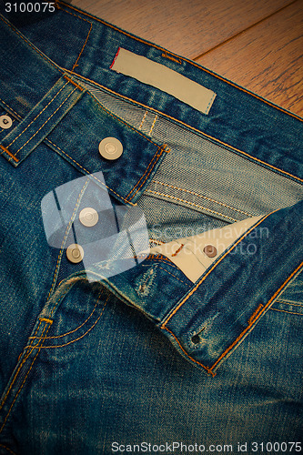 Image of unbuttoned jeans