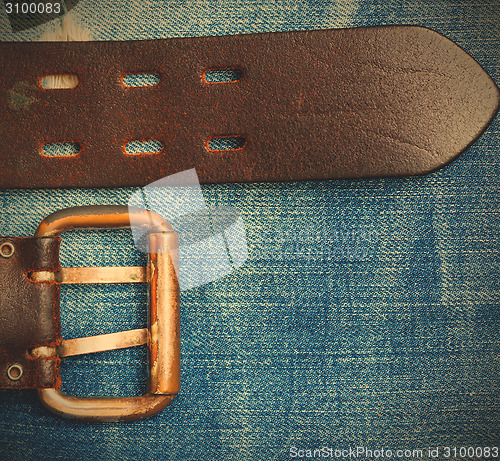 Image of Old leather belt with a buckle