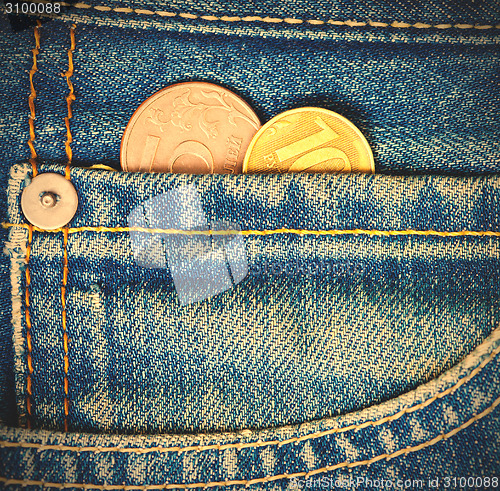 Image of Coins in pocket jeans