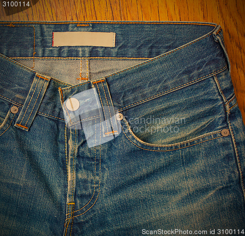 Image of indigo jeans with a button