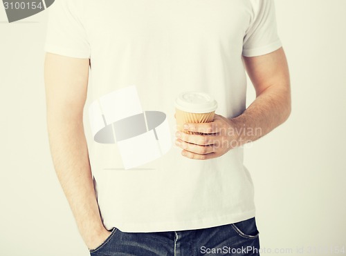 Image of man hand holding take away coffee