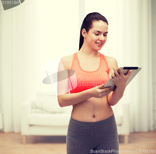 Image of sporty woman with tablet pc computer