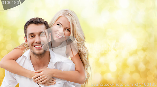 Image of couple having fun over blue lights background