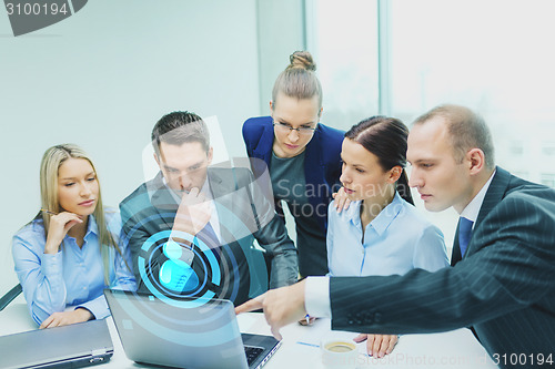 Image of business team with laptop having discussion