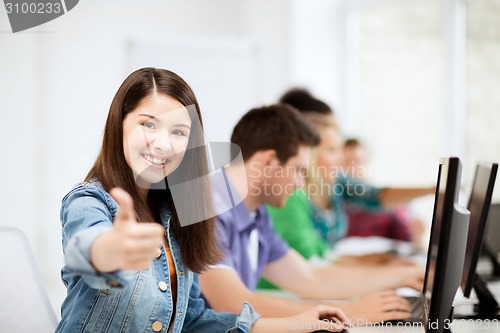 Image of student with computers studying at school