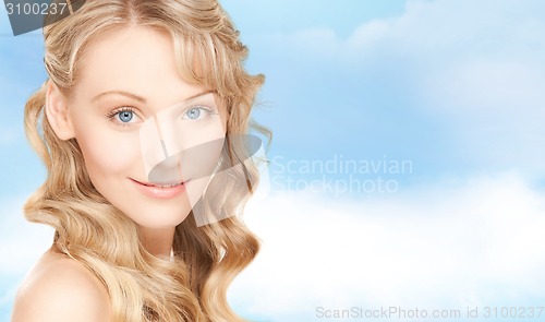 Image of face of beautiful young happy woman with long hair