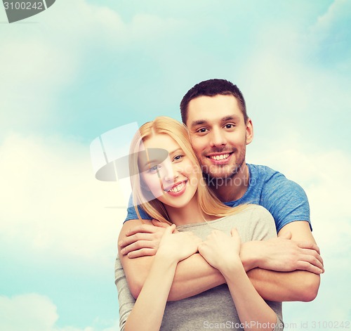 Image of smiling couple hugging