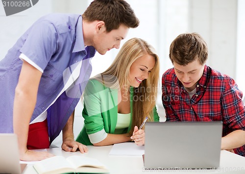 Image of students writing test or exam in lecture at school