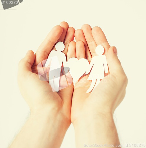 Image of man hands with paper men