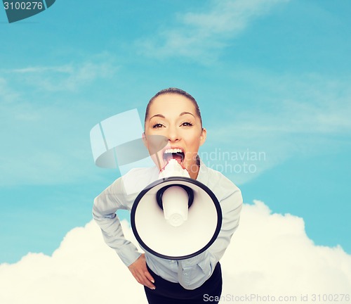 Image of screaming businesswoman with megaphone