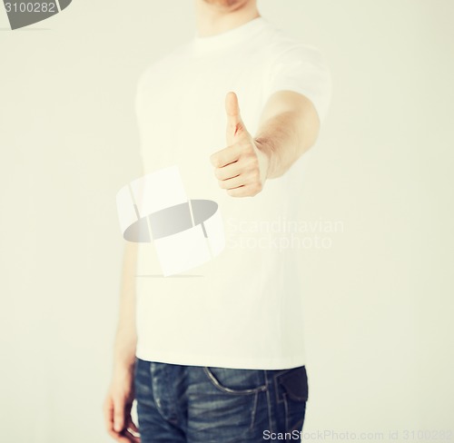 Image of man showing thumbs up