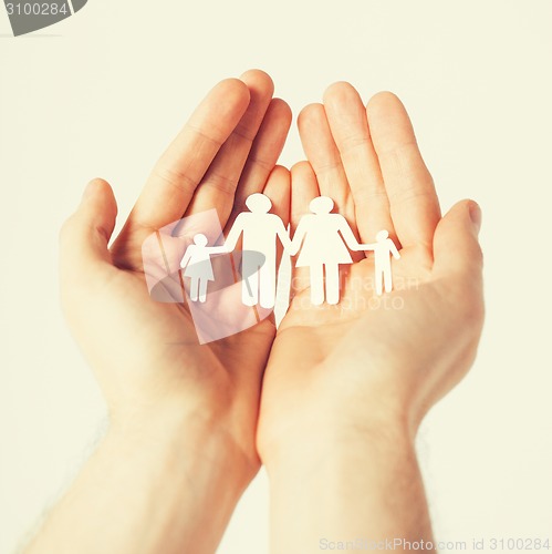 Image of man hands with paper men