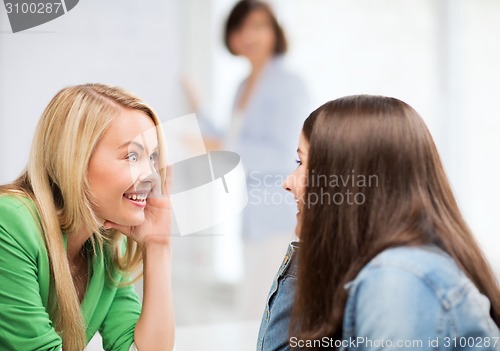 Image of student girls gossiping at school