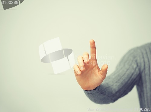 Image of man pressing imaginary button