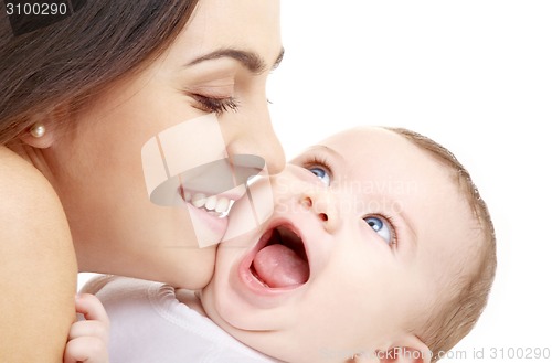 Image of mother kissing her baby