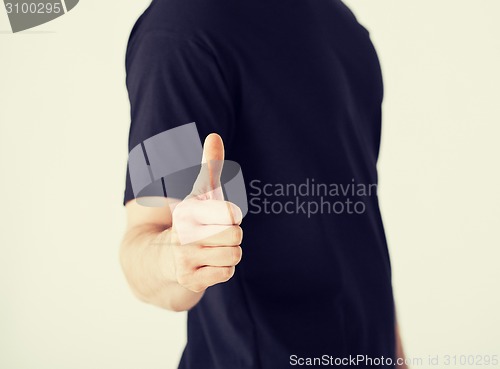 Image of man showing thumbs up