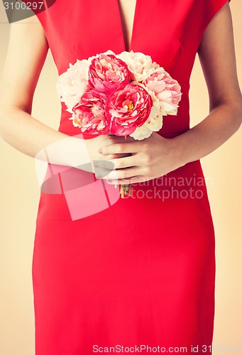 Image of woman hands with bouquet of flowers