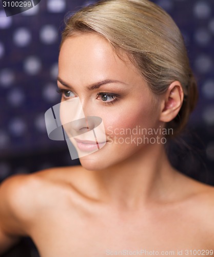 Image of close up of young woman sitting in bath towel