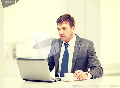 Image of businessman working with laptop computer