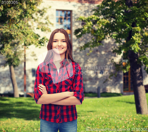 Image of smiling young woman in casual clothes