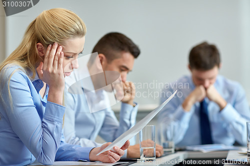 Image of business people having problem in office