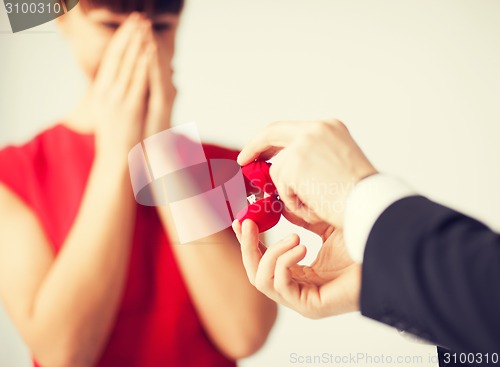 Image of couple with wedding ring and gift box