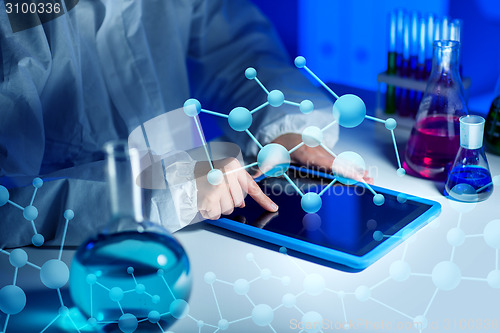 Image of close up of scientist with tablet pc in laboratory